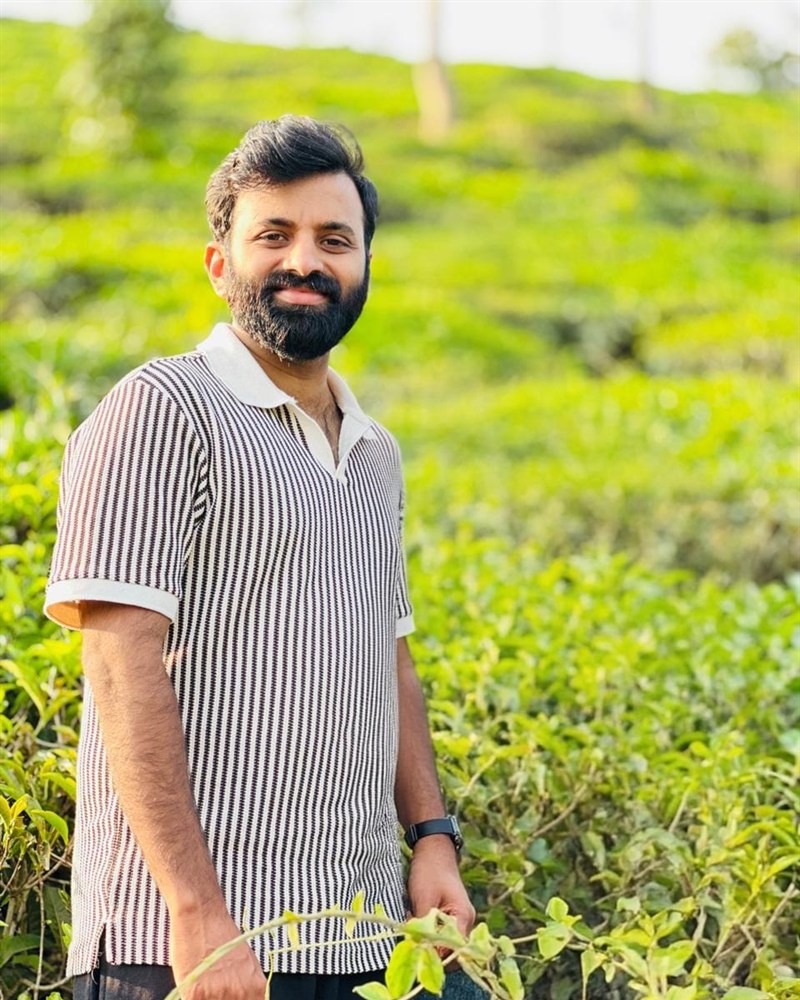 Fairooz Raheem standing in a tea garden in Kerala